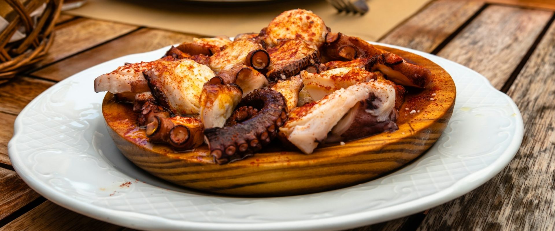 Galician style octopus with paprika, potatoes and olive oil in restaurant